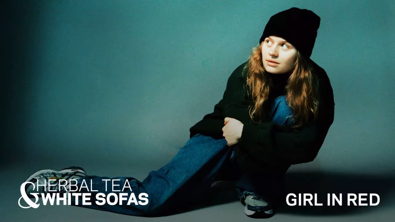 Girl In Red Wants A Private Jet But She’ll Settle For Twizzlers | Herbal Tea & White Sofas