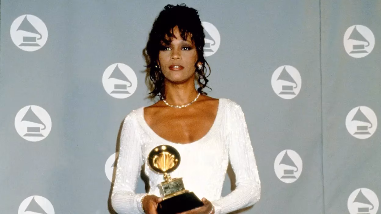 GRAMMY Rewind: Whitney Houston Admires Dolly Parton After “I Will Always Love You” Wins In 1994