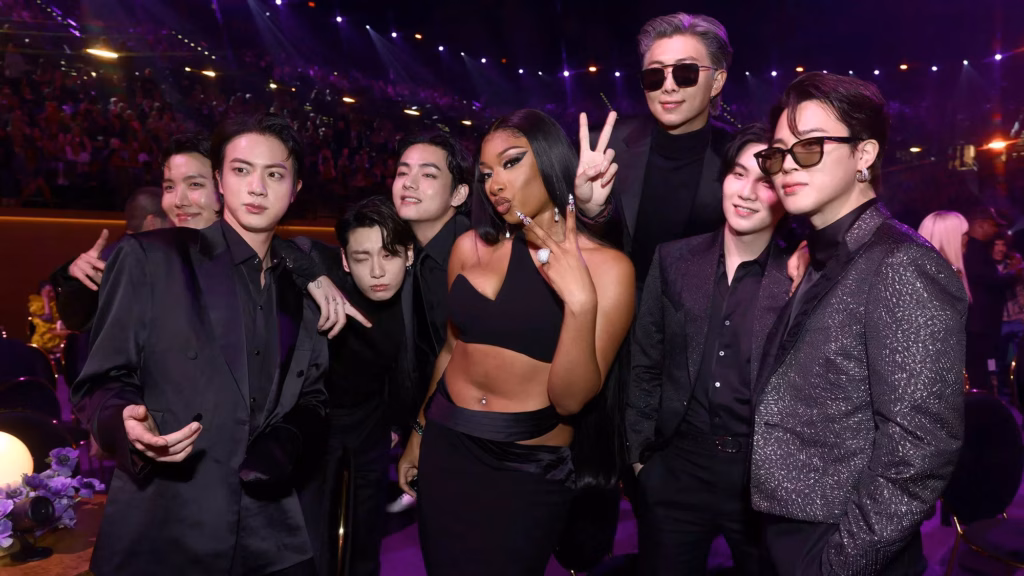 Megan Thee Stallion (Center) and (from L to R:) J-Hope, Jin, Jungkook, V, RM, Suga, and Jimin of BTS attend the 64th Annual GRAMMY Awards at MGM Grand Garden Arena on April 03, 2022 in Las Vegas, Nevada.