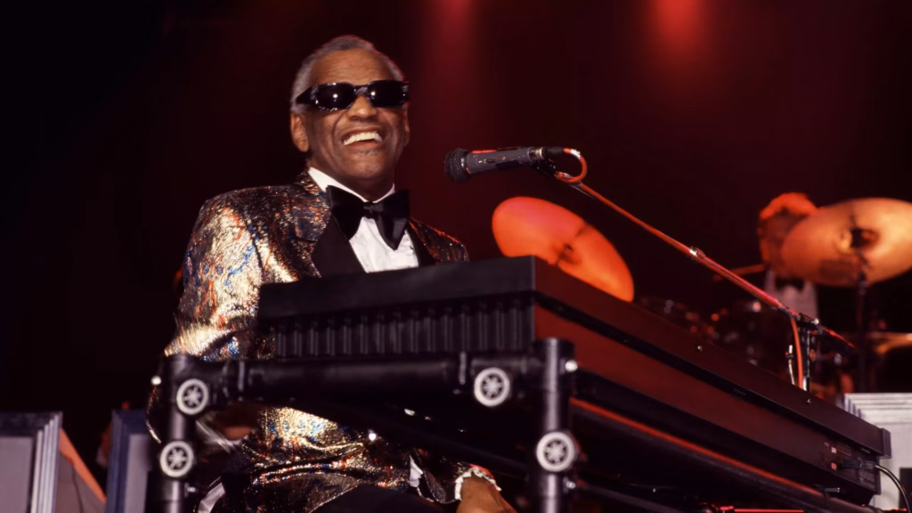 Ray Charles plays piano as he performs onstage in Portugal in 1988.
