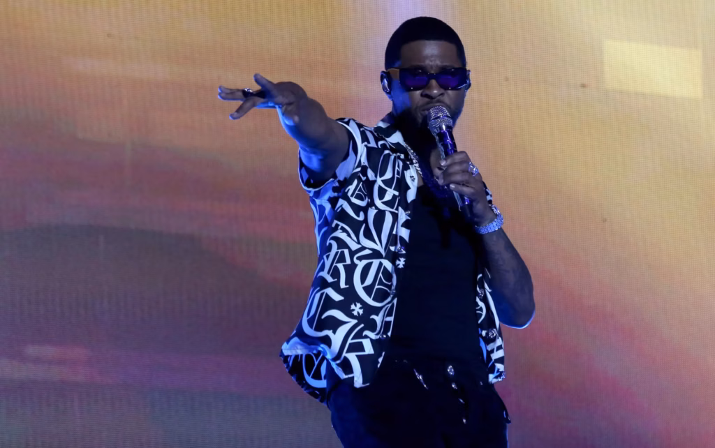 Usher performing in 2022