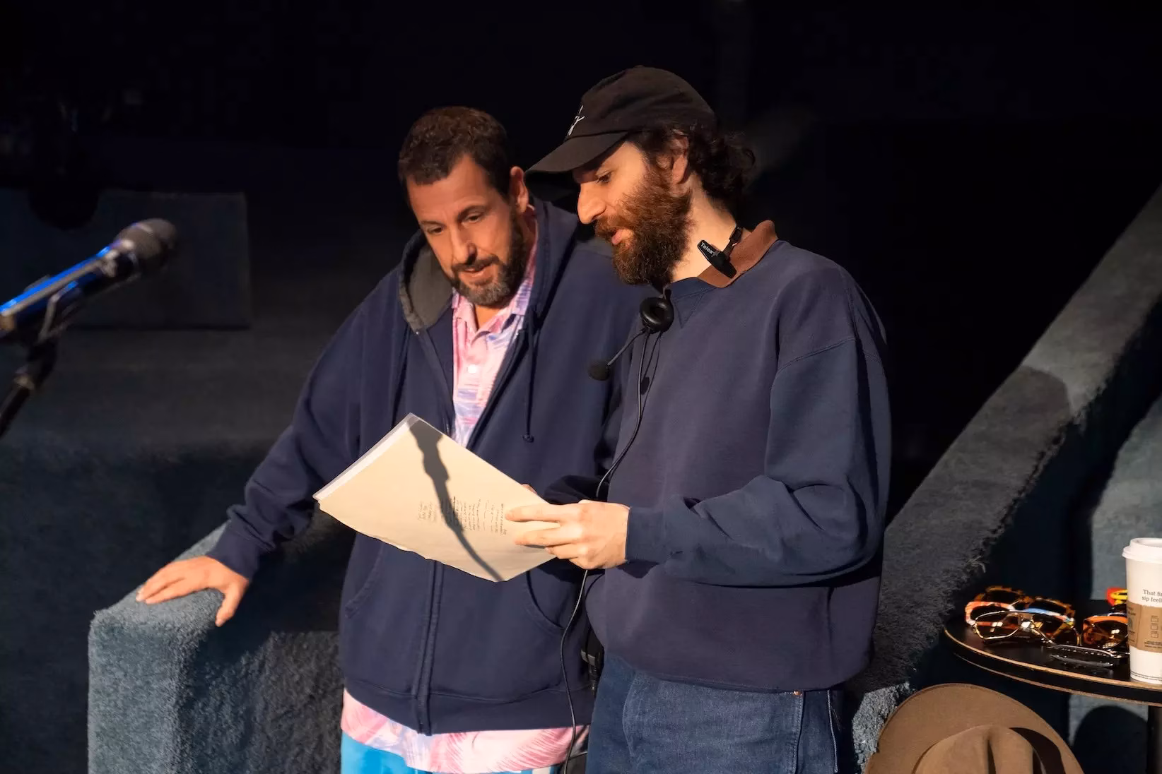 Still from Netflix's 'Adam Sandler: Love You.' Adam Sandler (L) and Josh Safdie (R) at the Nocturne Theater in Glendale, California.