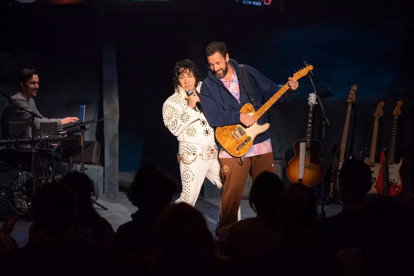 Still from Netflix's 'Adam Sandler: Love You.' Adam Sandler (R) and Rob Schneider (L) performing at the Nocturne Theater in Glendale, California.