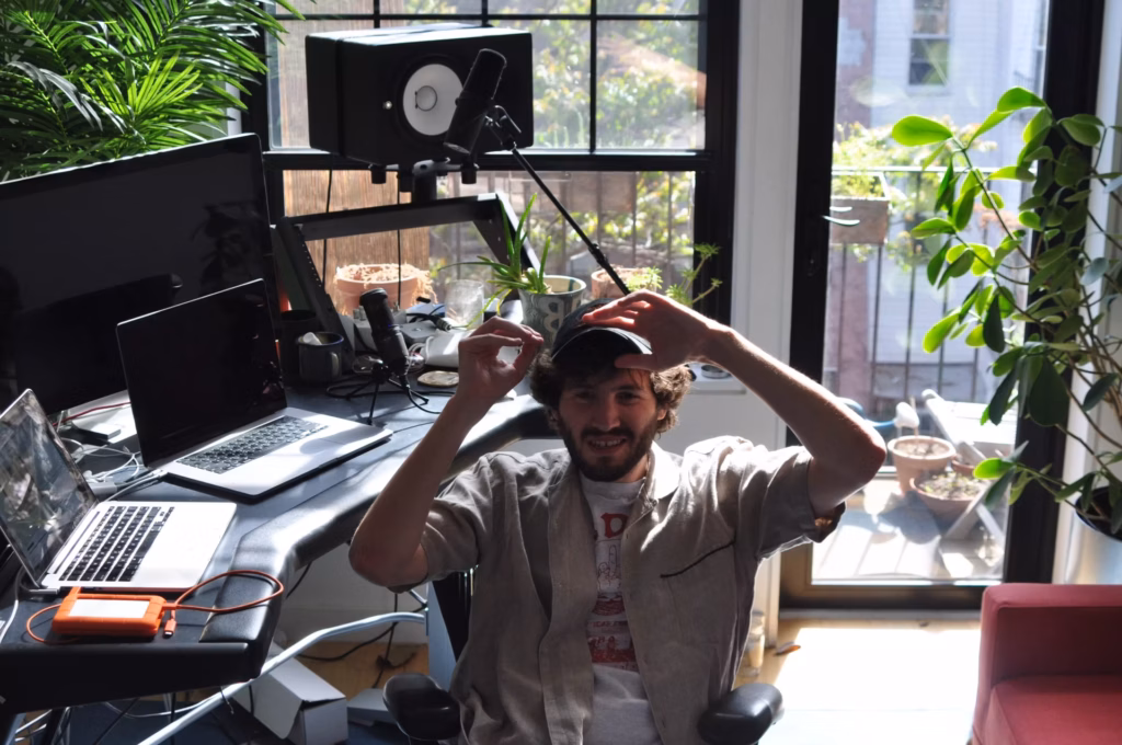 Baauer smiling in his at-home studio in Brooklyn