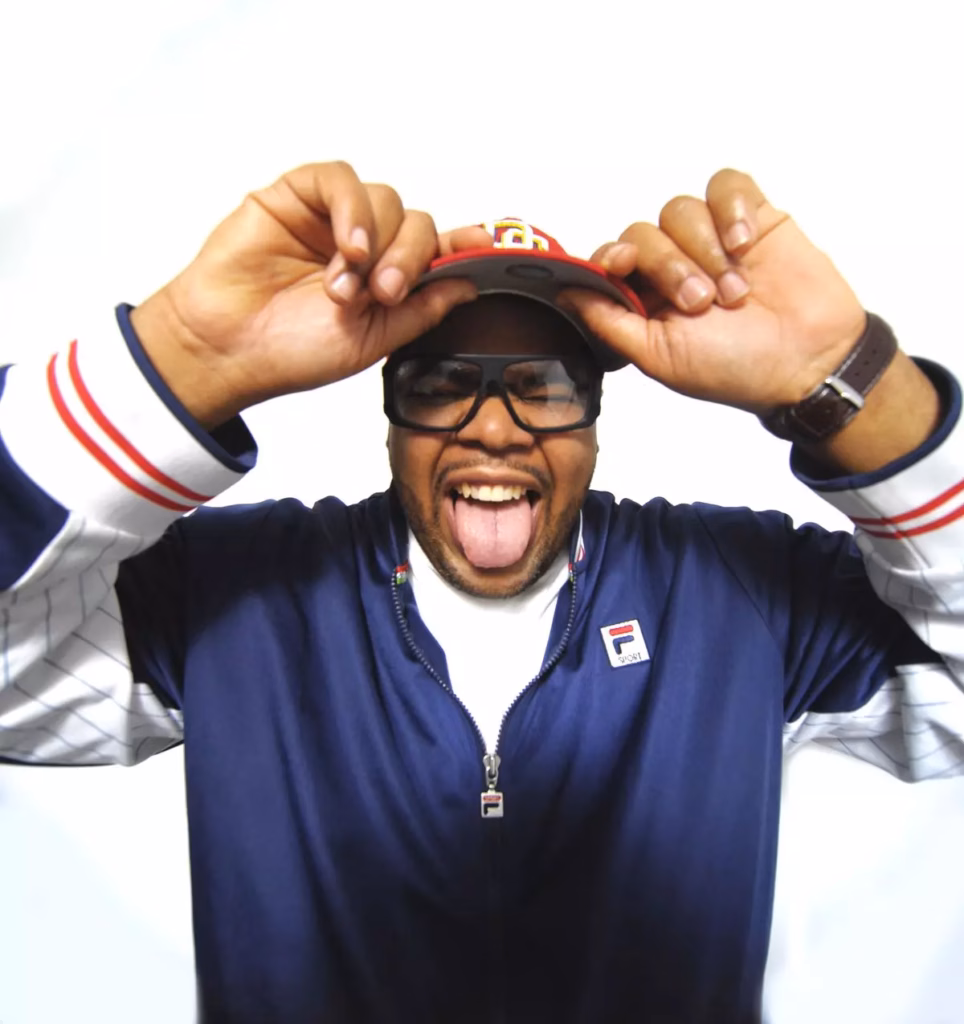 producer Chucky Thompson poses joyfully with his tongue out