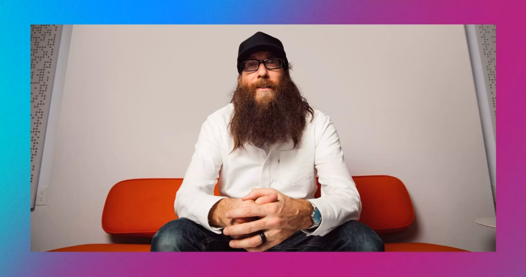 Photo of Crowder sitting on red couch