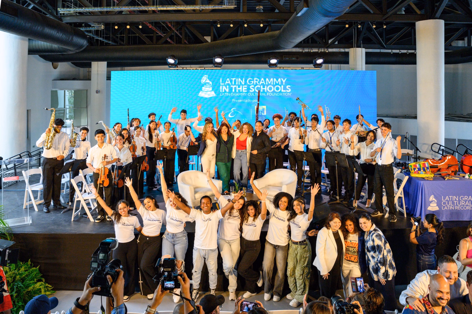 Erika Ender is surrounded by a crowd at a live educational program at Panama's Ciudad de las Artes, presented by the Latin GRAMMY Cultural Foundation in partnership with Ender's Fundación Puertas Abiertas.