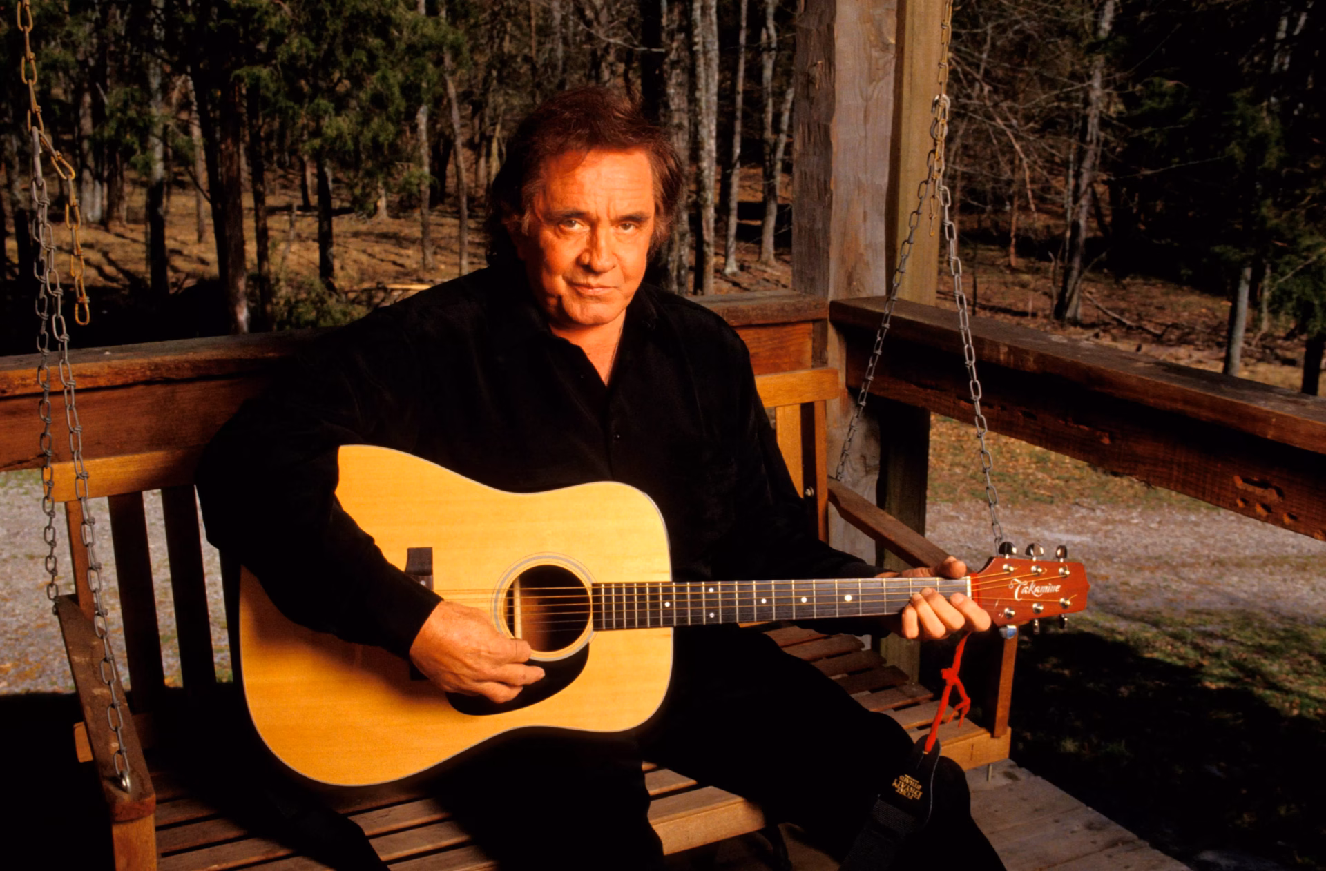 Johnny Cash holding a guitar