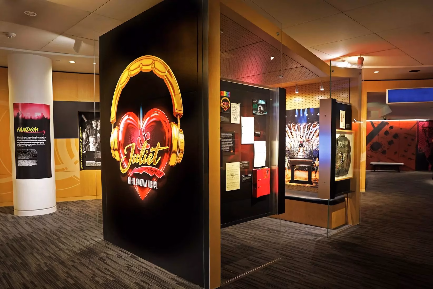A photo of the GRAMMY Museum's '& Juliet: The Music Of Max Martin And Friends' exhibit shows the logo of the 
