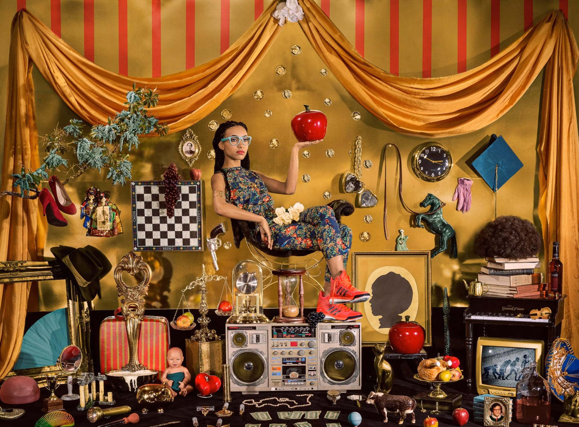 Esperanza Spalding sits atop a boombox in an elaborately decorated scene by photographer Holly Andres