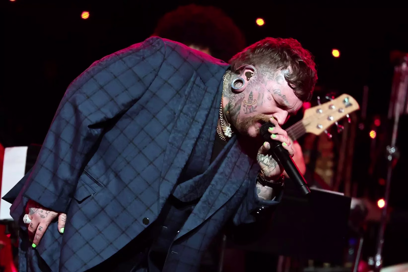 Teddy Swims performs onstage during the 2026 Grammy Hall of Fame Gala on Friday, May 8, 2026, at The Beverly Hilton in Los Angeles. Teddy Swims is wearing a blue suit and gold necklaces and singing into a microphone.