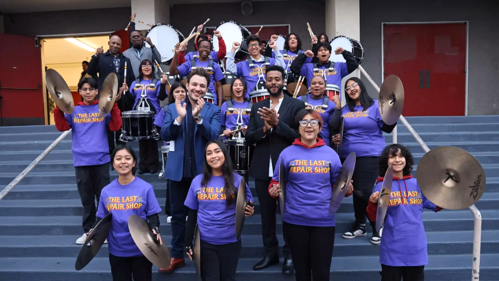 Filmmakers Ben Proudfoot and Kris Bowers pose with LAUSD band high school participants.