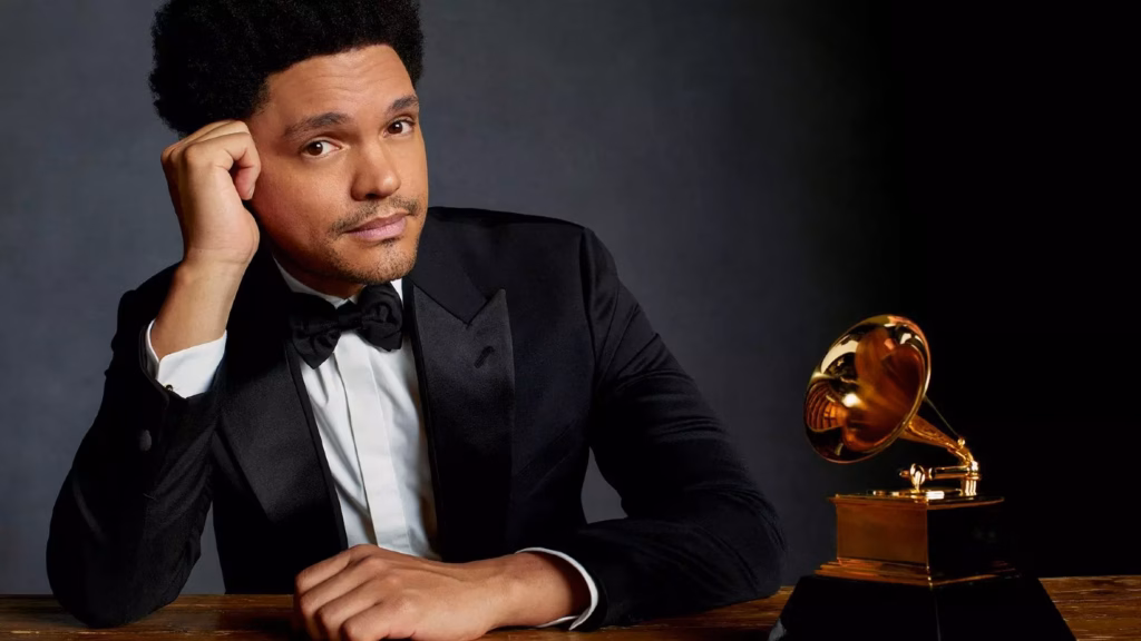 Photo of Trevor Noah next to a GRAMMY Award