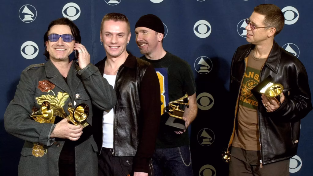 U2 pose with GRAMMYs backstage at the 43rd GRAMMY Awards in 2001