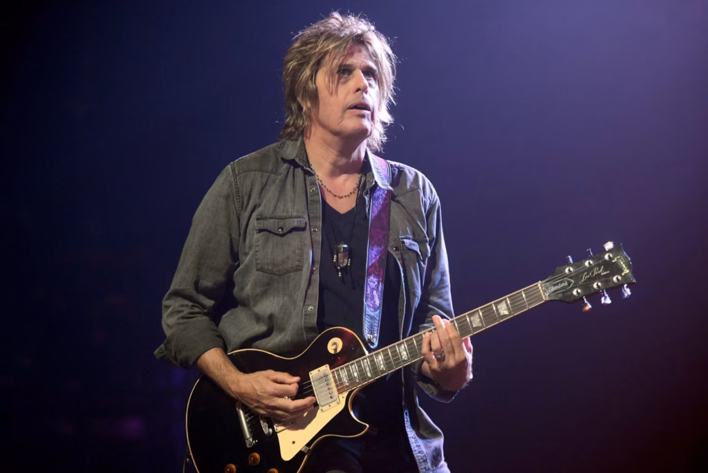 Dean DeLeo photographed onstage in 2017